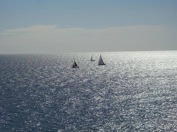 Yachts on the water beyond Killigerran Head